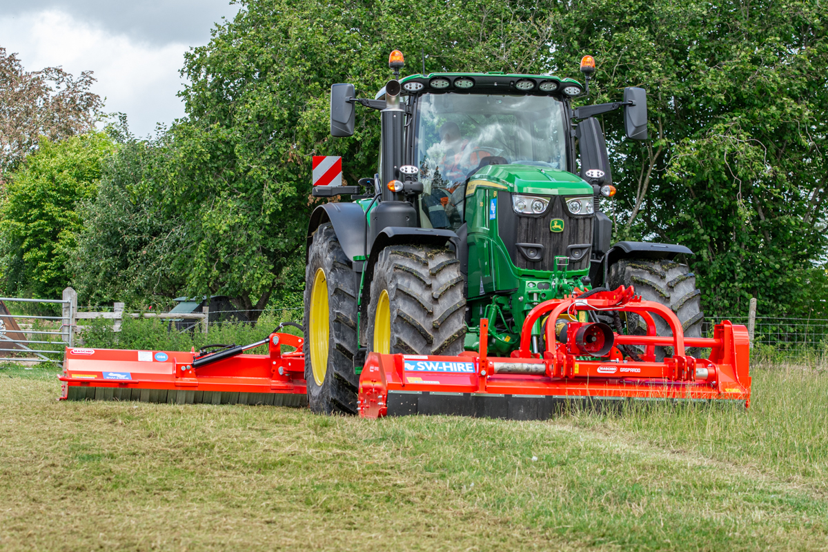 Maschio 2.8m front mounted topper and 2.6m side arm topper rear mounted on john deere tractor mowing a paddock
